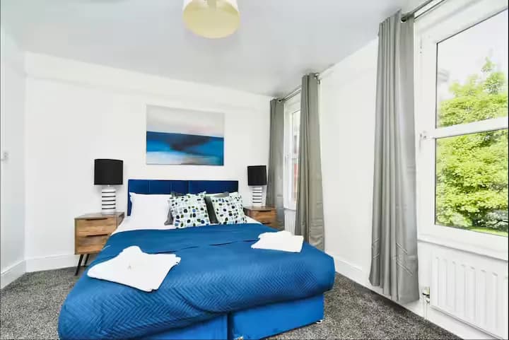 Bedroom with blue bedding
