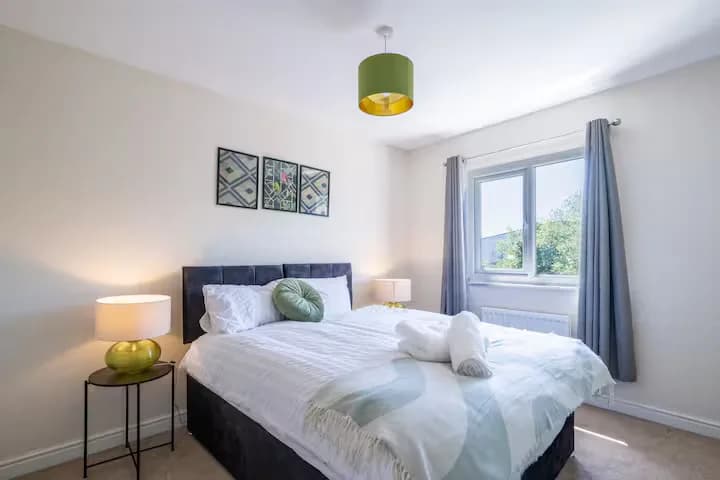 Bedroom with green cushions
