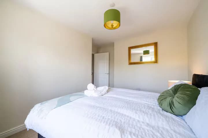 Bedroom with green cushions