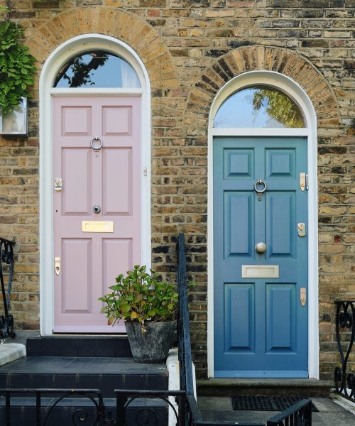A snapshot of two doors side by side in London. A snapshot of two doors side by side in London, presenting an intimate view of the city's architectural charm and diversity.
